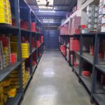 "GKSP Racking", Slotted angle racks Manufacturer- Manufacturing slotted angle racks with GI panels from a decade. This rack has 7 feet height and is in dark grey color and have stored many types of boxes with electrical items/materials inside.